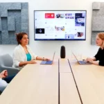 a group of people sitting around a conference table