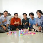 a group of men sitting next to each other