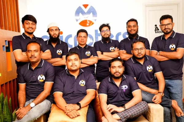 A group of men sitting next to each other