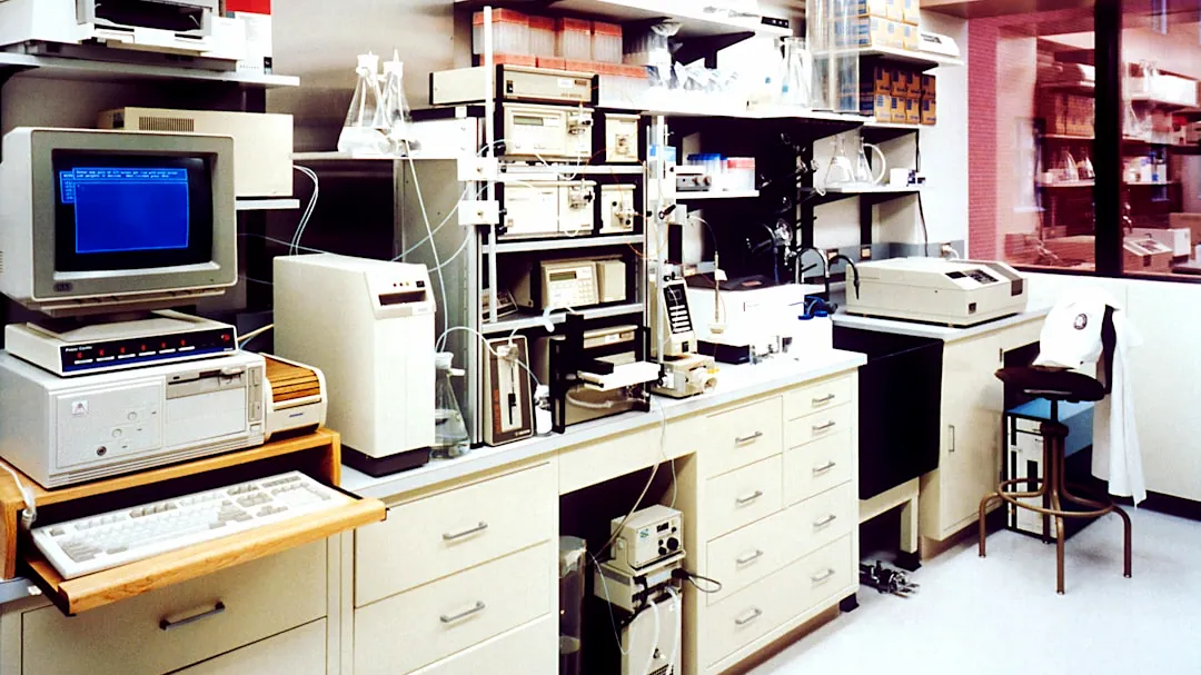 desktop monitor beside computer tower on inside room