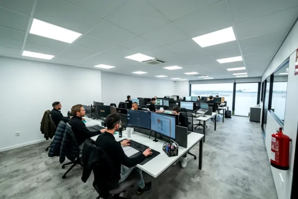 Office workers are busy working on computers.