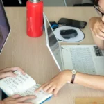 person using laptop inside room