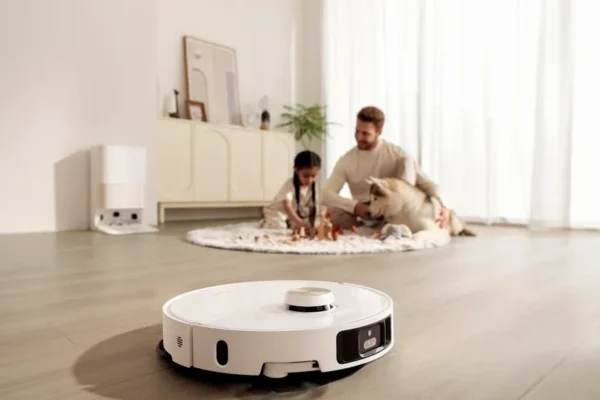 Robot vacuum cleans floor while family relaxes