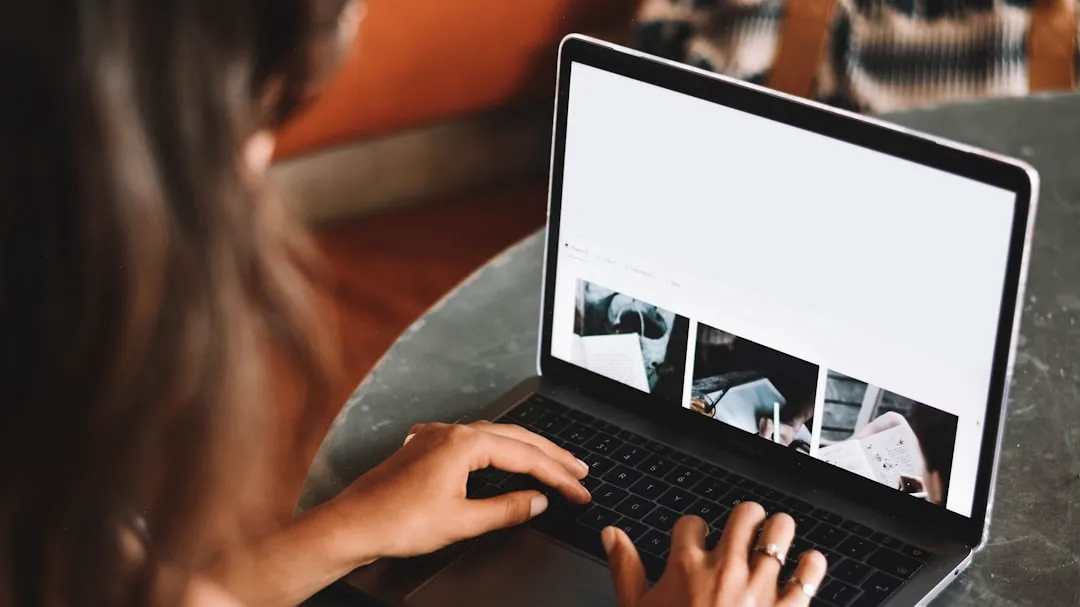 woman using macbook pro on table