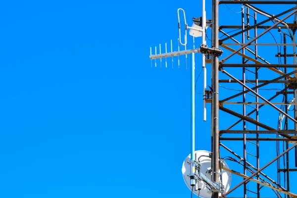 a cell phone tower with a cell phone on top of it