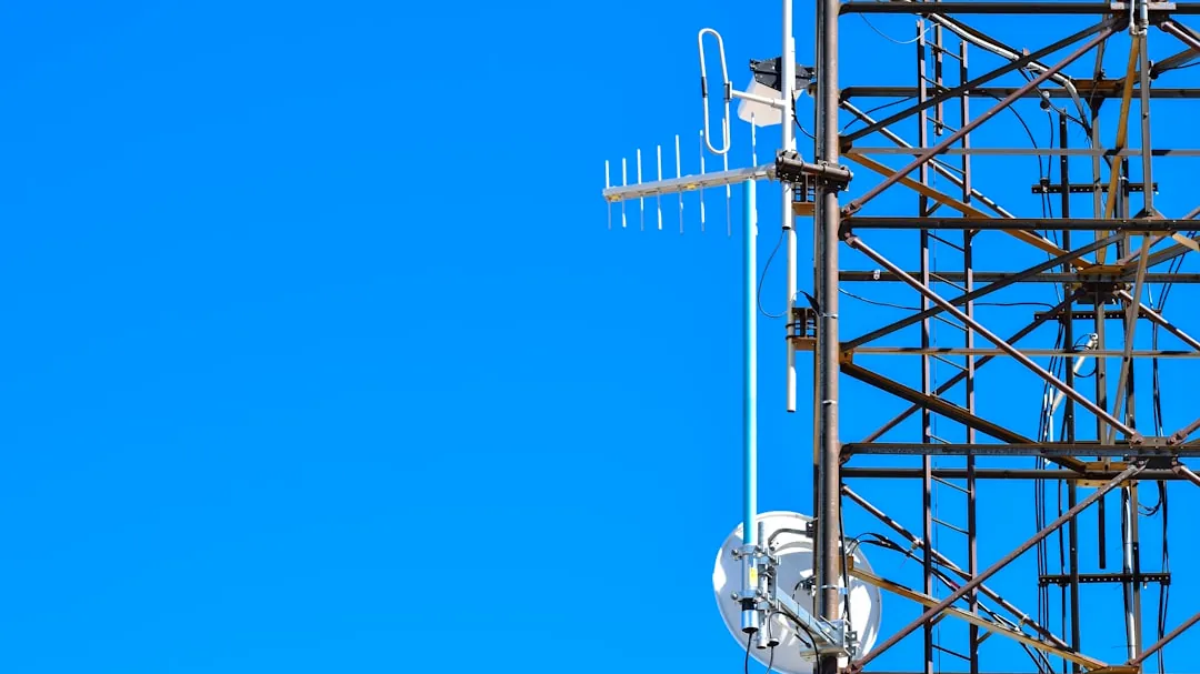a cell phone tower with a cell phone on top of it